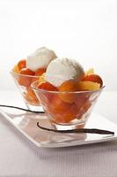 Papaya fruit dessert with oranges and ice-cream photo