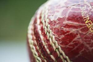 Worn out cricket ball photo