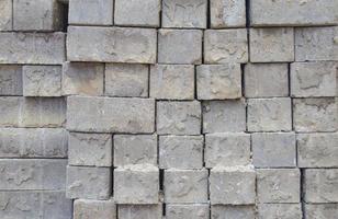 Grey bricks stacked in rows photo