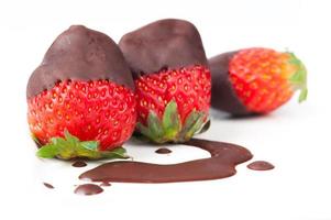 Row of strawberries dipped in delicious chocolate
