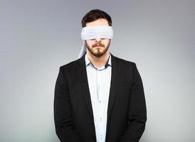 Blindfolded elegant man photo