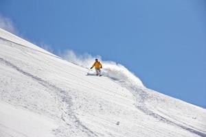 Skier in deep powder, extreme freeride photo