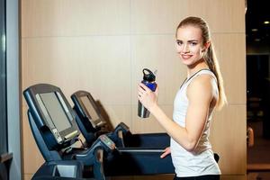 Pretty girl working out in a treadmill at the gym