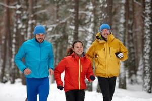 Group of people running in winter