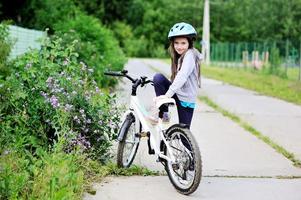 Little girl on bike photo