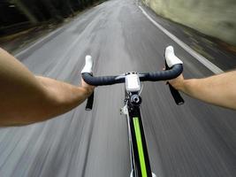 Going Down with Bicycle on the Road. pov