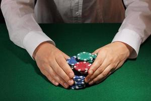 Taking win in poker on green table