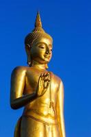 Stand Golden Buddha Statue in Thailand