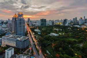 Sunset in Bangkok with Lumpini park photo