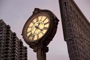 Fifth Avenue Clock and Flatiron building photo