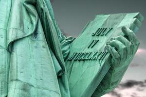 Statue of liberty is holding a tablet