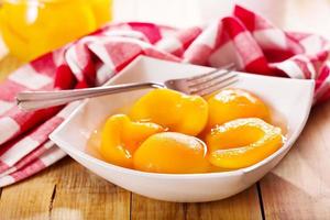 canned peaches in a bowl photo