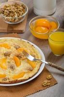 Sweet Egg omelet with walnuts and peaches photo
