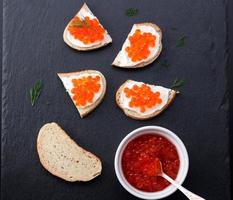 Bread with fresh cream cheese and red caviar