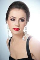 attractive woman with red lips and creative makeup photo