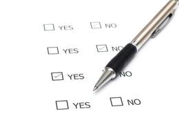 Mark Yes with pen on survey paper document