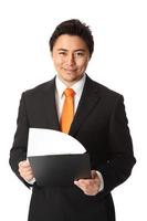 Businessman in a suit and tie holding a document