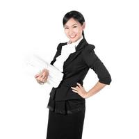 Young pretty business woman holding pile of document photo