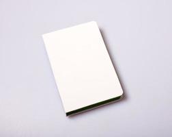 Notepad blank cover on white table photo