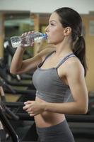 Female Runner Drinking Water photo