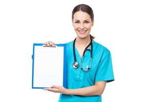 Female doctor holding a clipboard photo