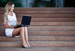 Young attractive businesswoman with a notebook photo