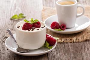 Cream dessert with raspberries photo