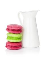 Colorful macarons and milk jug photo
