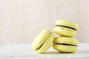 French macarons on white wooden background