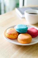 Colorful French Macarons with coffee photo