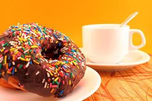 Chocolate donuts and coffee cup photo