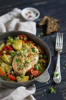 chicken fillet with bread crumbs and baked vegetables photo