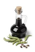Bottle with soy sauce and fresh soybeans