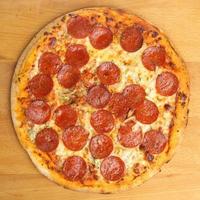 Aerial view of a pepperoni pizza photo