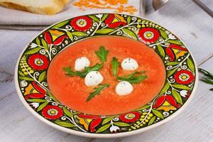 Red lentil and tomato soup with mozzarella photo