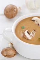 Mushroom soup closeup with mushrooms in bowl photo