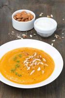 carrot soup with almonds and watercress, vertical