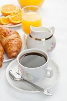 Breakfast with coffee and croissants photo