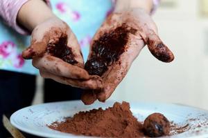 Cook Making Truffles with Hands photo