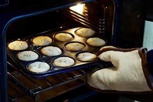 Homemade mince pies coming out of oven photo