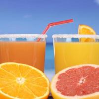 Orange juice from oranges at the sea photo