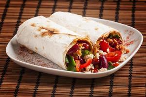 Traditional Mexican food, burritos with meat and beans, selectiv photo