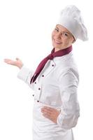 Female chef motioning to her work photo
