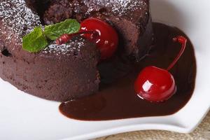 fondant chocolate cake with cherries and mint macro horizontal