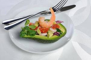 Appetizer of avocado with prawns photo