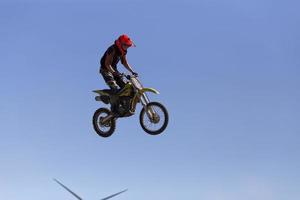 Motorcycle jump and part of a turbine photo