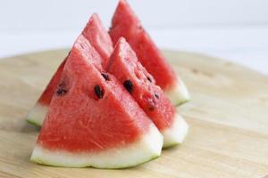Slices of watermelon on white background photo