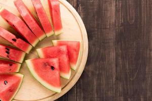 Healthy slice watermelon on a wood background
