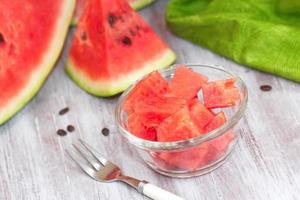 Slices of watermelon on the wooden table photo