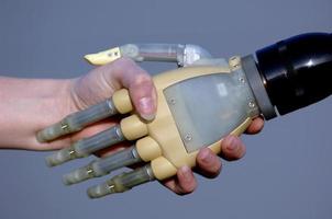 Human and Bionic handshake photo